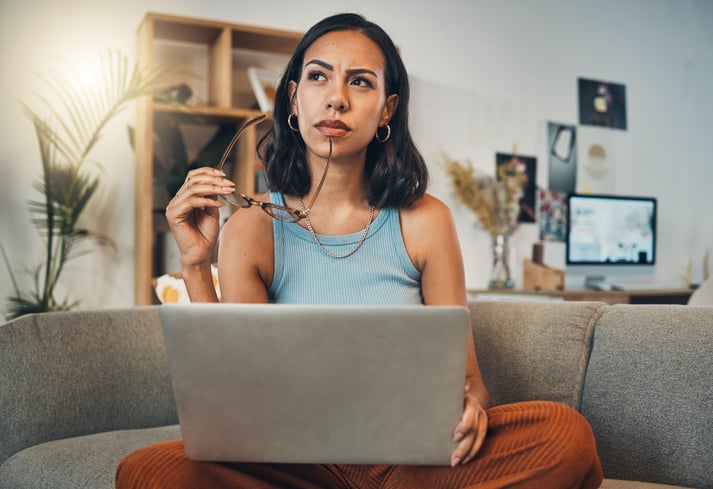 woman sitting at her laptop working